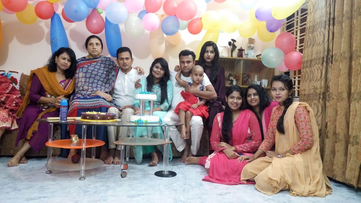 South Asian extended family celebrating together at home
