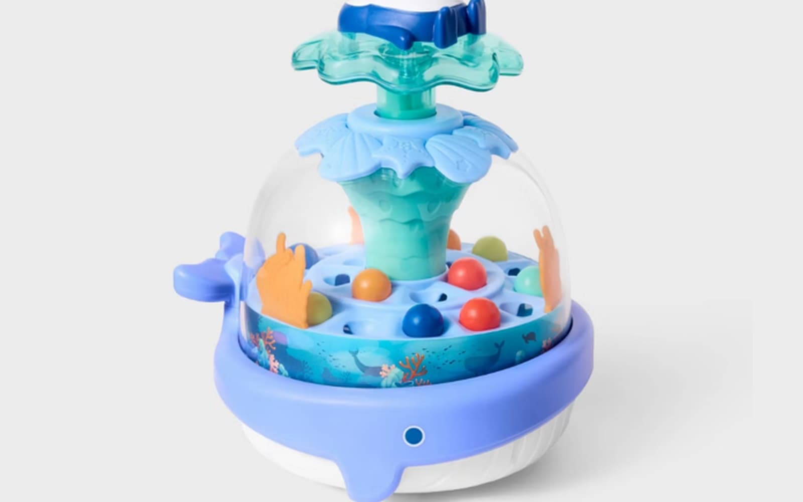 Recalled Gigglescape Under the Sea Popping Toy with a clear dome of colored balls on a blue whale-shaped base
