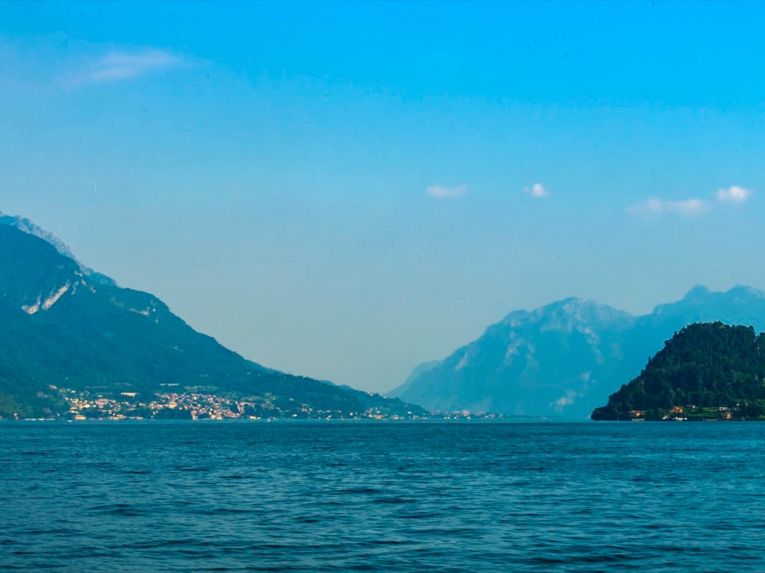 Bellagio and the hills of Lake Como seen from the Menaggio–Varenna ferry on a clear day