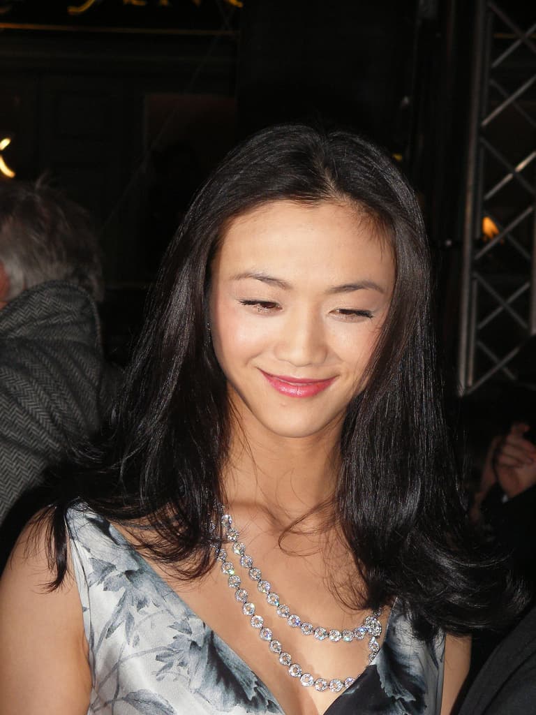 Tang Wei smiling at a red-carpet event in 2008