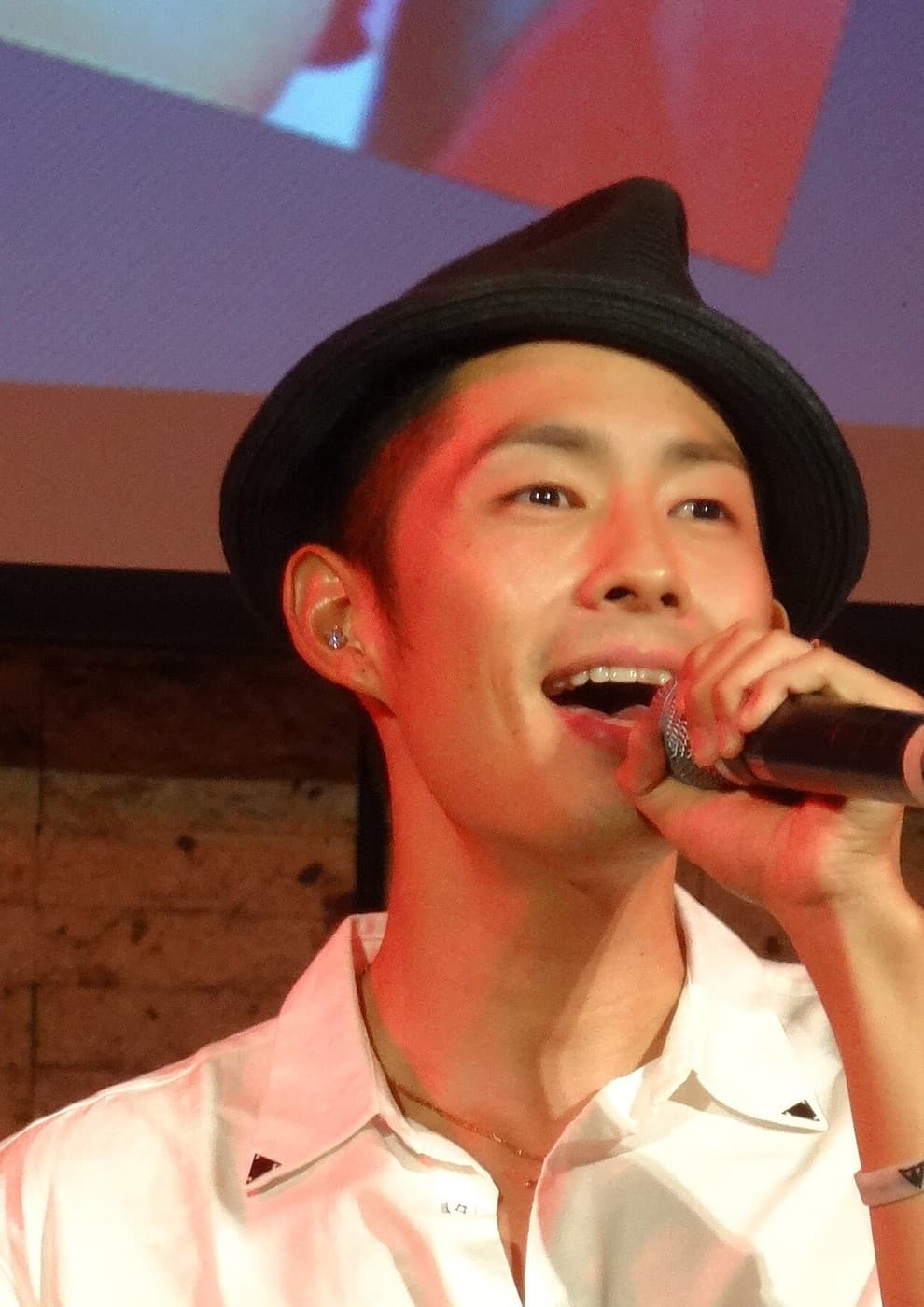 Vanness Wu performing on stage at a family music event in Taipei, 2012